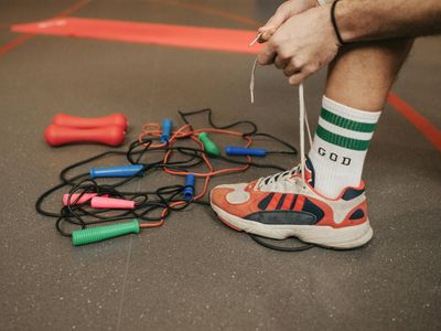 A pair of athletic shoes on a clean floor, ready for activity.